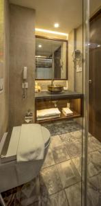 a bathroom with a toilet and a sink at Nepali Ghar Hotel, Thamel - Your Home In Nepal in Kathmandu +94 photos