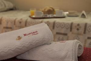 Cama ou camas em um quarto em Hotel Xumec Mendoza