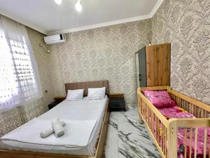 a small room with two beds and a window at Gabala Luxury Nature Villa in Gabala