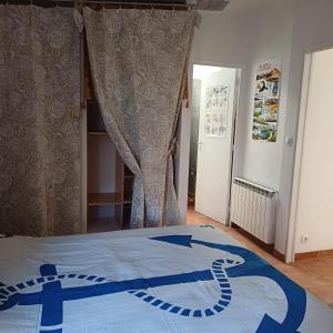 a bedroom with a bed with a snake on it at L'atelier d'LN in La Roque-dʼAnthéron
