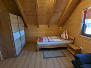 a small room with a bed in a cabin at Studio DG für 1 Person in Kelheim