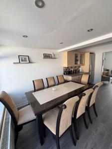 a dining room with a table and chairs at Craigport Cottage in Portrush