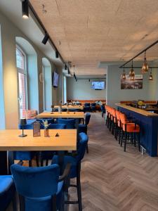 a dining room with tables and chairs and a bar at JOSEFS Gasthaus Sibille in Schlangen