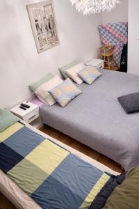 two beds sitting next to each other in a room at Top in Oulu