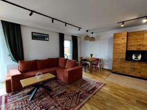 a living room with a couch and a table at Chata na Psiaku in Wrocław