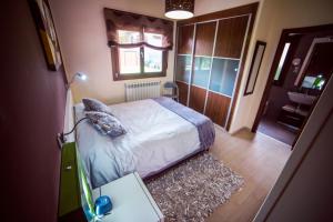 Un pat sau paturi într-o cameră la El Mirador de la Toba