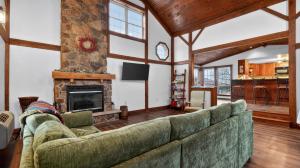 a living room with a couch and a fireplace at Victory View in Gettysburg