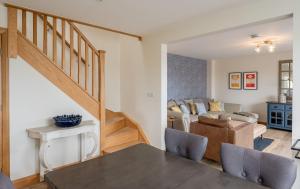 a living room with a table and a living room at Ellesmere Barn in Bedale