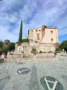 a large building in front of a building at Casa Adamo 77 in Badolato +33 photos
