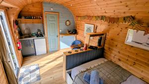 an overhead view of a tiny house with a kitchen at Emlyn's Coppice - Luxury Woodland Glamping in Holywell