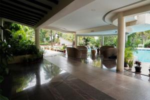 a lobby of a house with a swimming pool at Ctrl Alt Heal Sparsh Integrated Wellness Center in Hyderabad