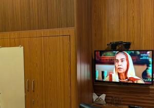 a flat screen tv sitting in a wall at Hotel Meerut International in Meerut