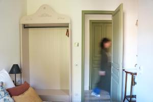 a person walking through a door in a room at La Torre Retreat in Borredá