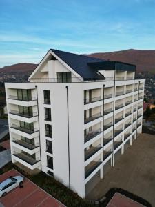 an overhead view of a white building with a roof at Apartmán Sekvoja in Nová Baňa