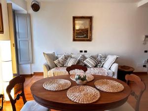 a living room with a table and a couch at Il re di Torino in Turin