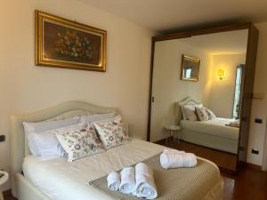 a bedroom with a bed with towels on it at Il re di Torino in Turin