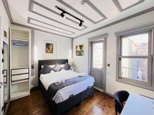a bedroom with a bed and a window at Rovigo Hotel in Istanbul