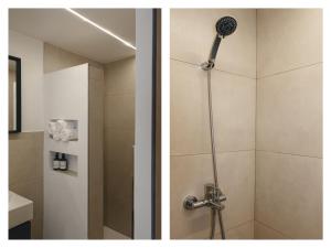 a bathroom with a shower with a shower head at Brisaolea - La Parcela in Peniscola +25 photos