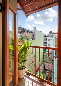 a balcony with a view of a city at Jan Casa in Ho Chi Minh City