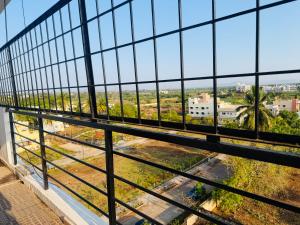 a view from the top of a building through a window at The Hampiness Studio 2 in Hospet