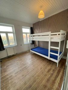 a bedroom with two bunk beds in a room at Villa Katry in Augustenborg