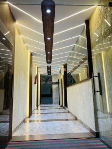 an empty hallway in a building with a ceiling at hotel shree palace in Ratlām