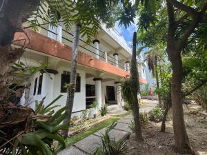 an exterior view of a building with trees at Boracay Garden Retreat in Boracay