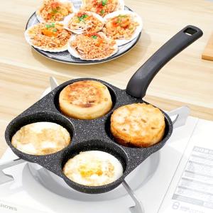 a frying pan with eggs and bread on a table at Mansarda Portofino in Portofino +5 photos