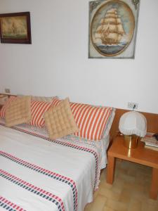 a living room with a bed and a couch at Magic View in Tuscany in Capo D'Arco