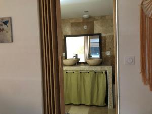 a bathroom with two sinks and a mirror at Natur eau Bulle in Ploufragan +25 photos