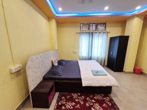 a bedroom with a bed in a room at Nmck Homestay in Guwahati