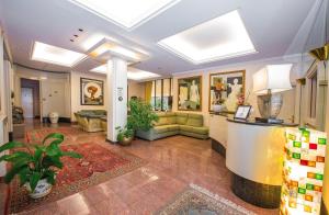 a lobby with a couch and a table in a building at La Bastia Hotel & Resort in Soriano nel Cimino +49 photos