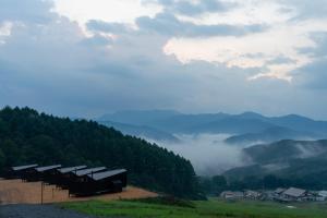 a row of shelters on top of a mountain at Earthboat Minakami Hodaigi in Minakami +56 photos