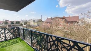 a balcony with a view of a city at YoniHarmony - 2 parking places in Sosnowiec