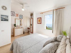 a white bedroom with a bed and a window at Luxury House - Montesol ALBERT VILLAS in Alcossebre +36 photos