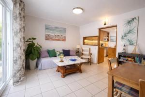 a living room with a couch and a table at Luxury House - Montesol ALBERT VILLAS in Alcossebre
