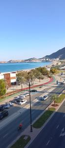 an aerial view of a street with cars parked at Coral Bay King Studio in Khor Fakkan