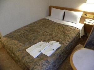 Postel nebo postele na pokoji v ubytování Hotel New Green Okachimachi