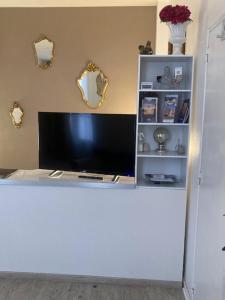 a white counter with a tv on top of it at Albi-Suite in Albi