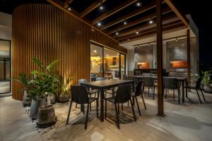 a dining room with a table and chairs at WELL Residences - By AVA Rentals in Asunción