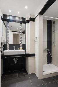 a bathroom with a sink and a shower at NOHO Boutique Koukaki , premium living in Athens +67 photos