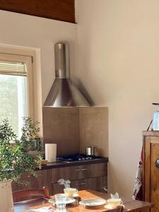 a kitchen with a stainless steel stove top oven at Agriturismo Ca' Cristane in Rivoli Veronese