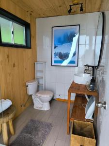 a bathroom with a toilet and a sink at Mirada al Mar in Matanzas +34 photos