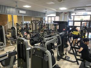 a gym with people working out in the gym at Torre del Fuggisole in Siena