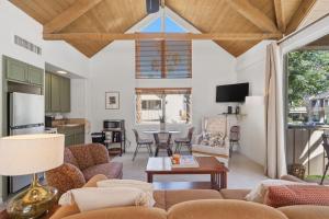 a living room with a couch and a table at Desert Escape with Private Balcony condo in Indian Wells