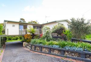 a house with a garden in front of it at The Salt Shack in Mallacoota