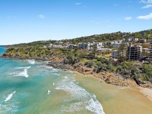 an aerial view of a beach with condos at Summer Cove on the Ocean with Pool in Coolum Beach