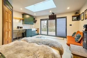 a living room with a large rug on the floor at The Churchside Well in Ravenscar +5 photos