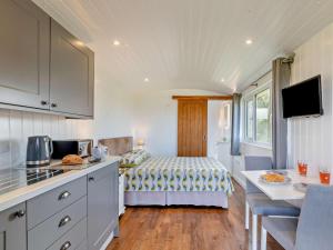 a kitchen with a bed in a small room at 1 Bed in Bridport oc-90055 in Whitchurch Canonicorum +9 photos