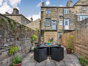a patio with a table in front of a building at 2 Bed in Harrogate oc-88933 in Pateley Bridge